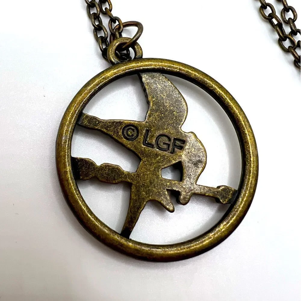 *3/$20* Hunger Games Mockingjay bronze tone necklace